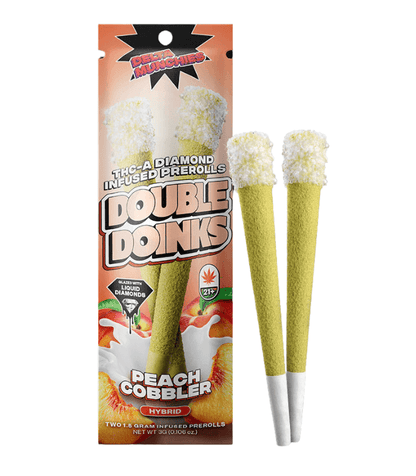 A package of Delta Munchies THC-A Diamond Infused Prerolls | 2pk, Peach Cobbler flavor, featuring two hybrid pre-rolls. The package showcases an image of the pre-rolls and is labeled with cannabis and age restriction symbols.